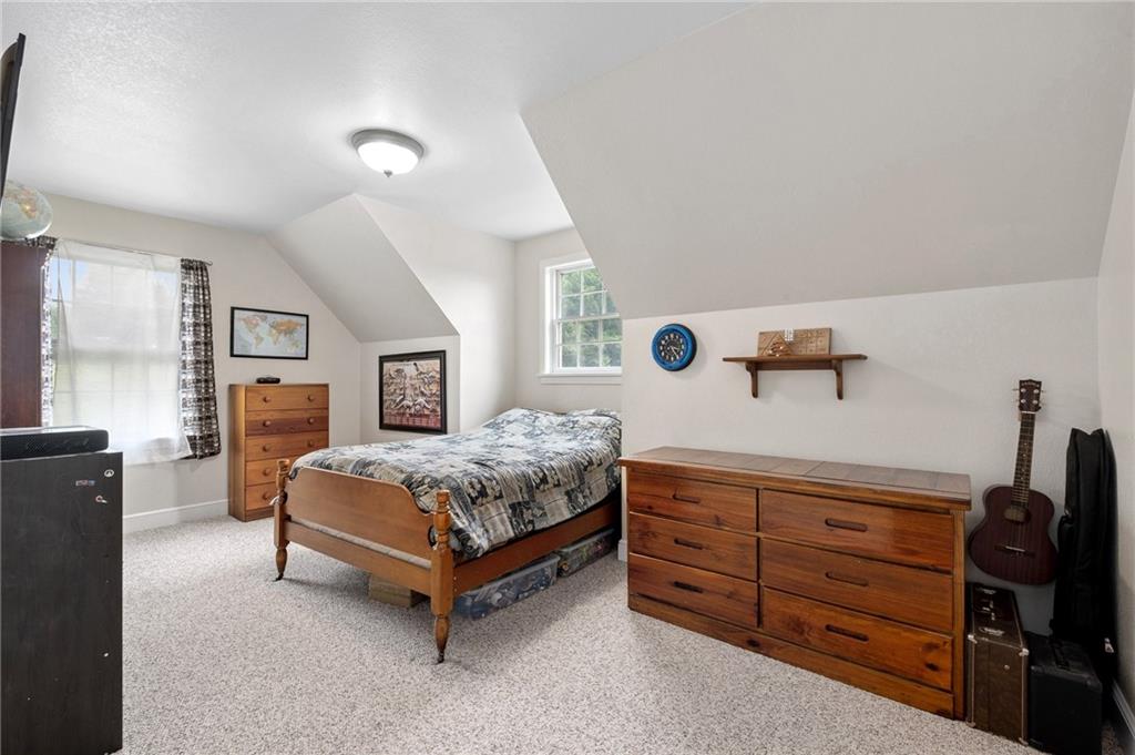 116 Country Lane Road Butler, PA 16001 - Photo 24 of 50 a bedroom with a bed and wooden floor