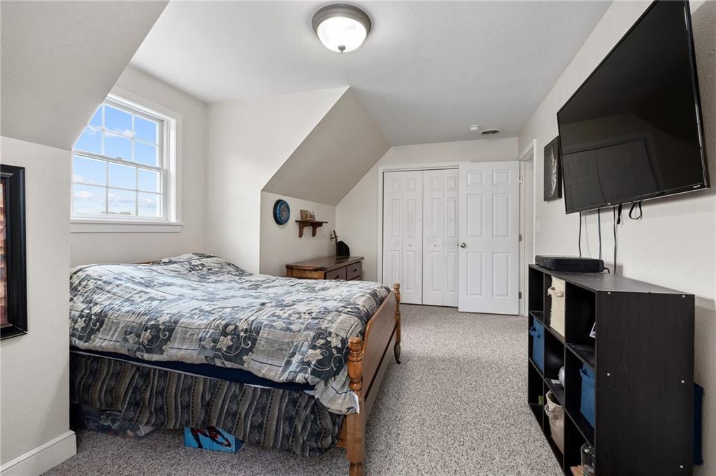116 Country Lane Road Butler, PA 16001 - Photo 25 of 50 a bedroom with a bed and flat screen tv