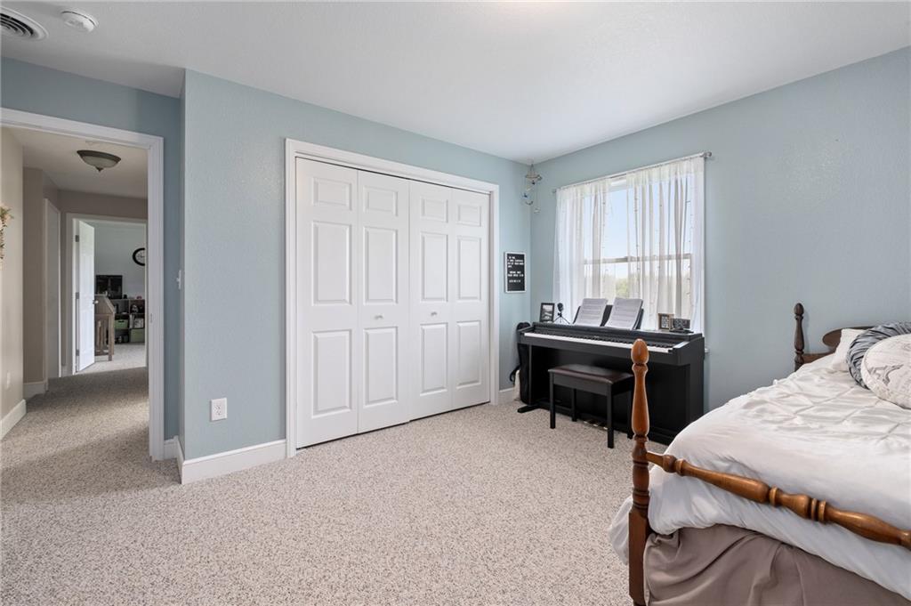 116 Country Lane Road Butler, PA 16001 - Photo 27 of 50 a bedroom with a bed and a window