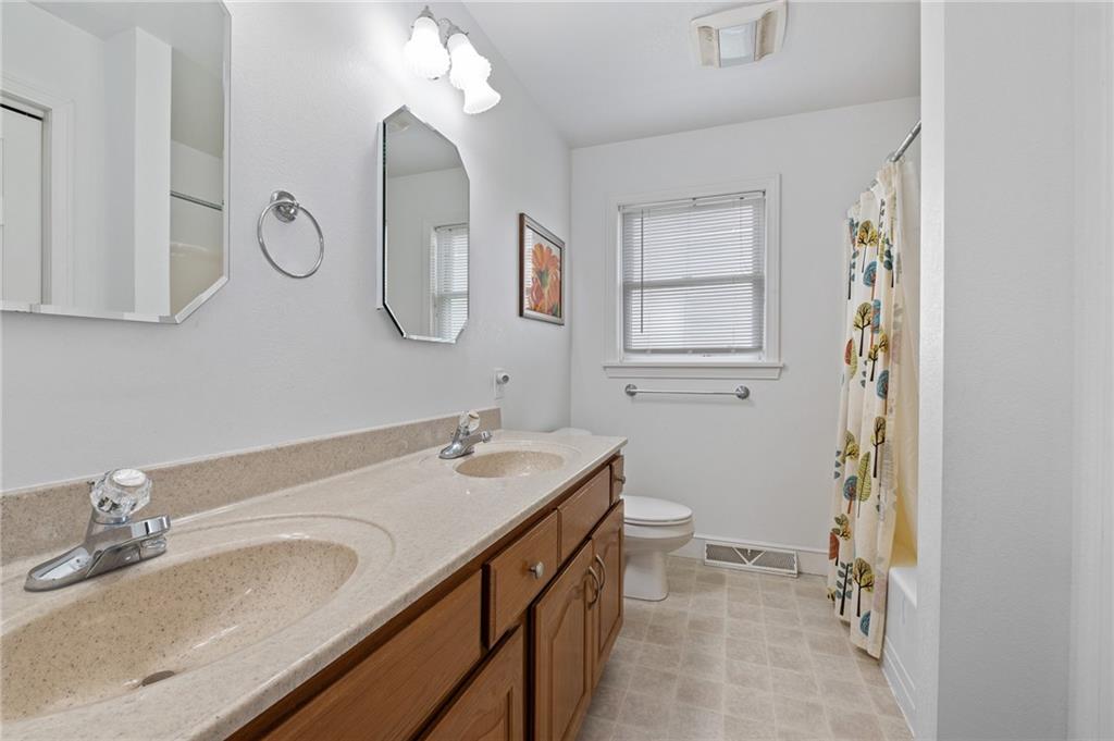 116 Country Lane Road Butler, PA 16001 - Photo 28 of 50 a bathroom with a double vanity sink mirror and toilet