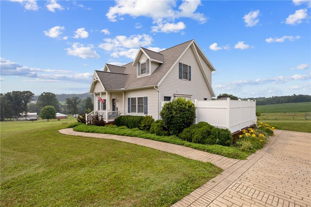 116 Country Lane Road Butler, PA 16001 - Photo 6 of 50 a front view of a house with garden