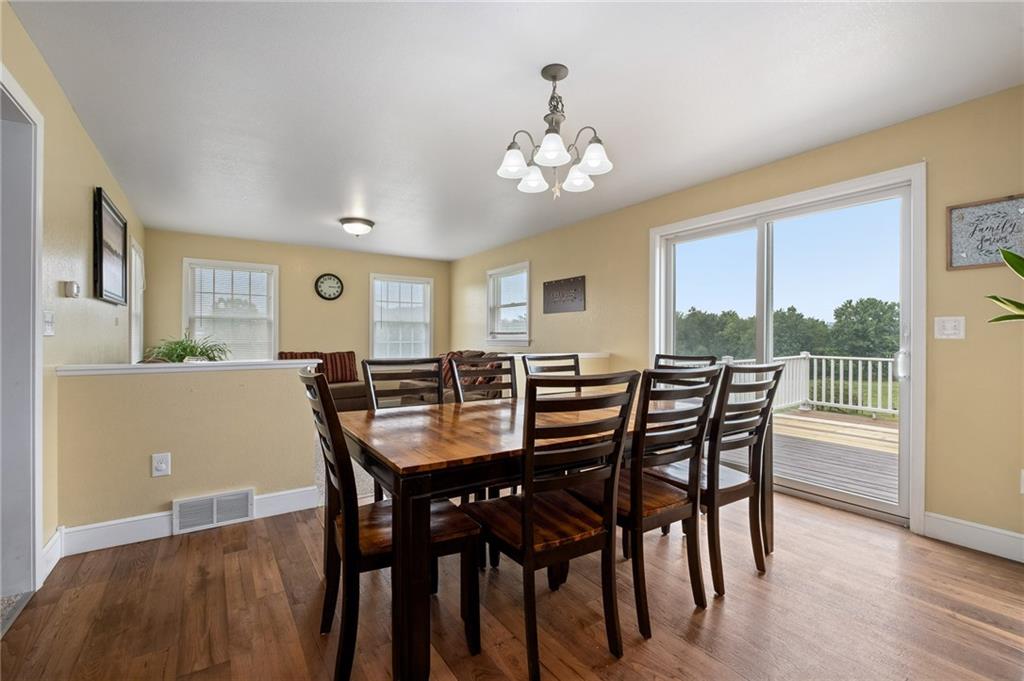 116 Country Lane Road Butler, PA 16001 - Photo 10 of 50 a view of a dining room with furniture window and wooden floor