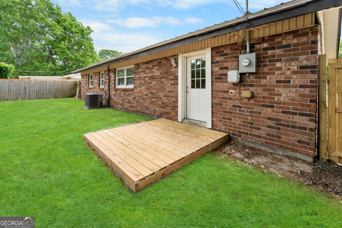 320 West Whatley Street Pooler, GA 31322 - Photo 27 of 34 a view of a backyard with plants and large tree