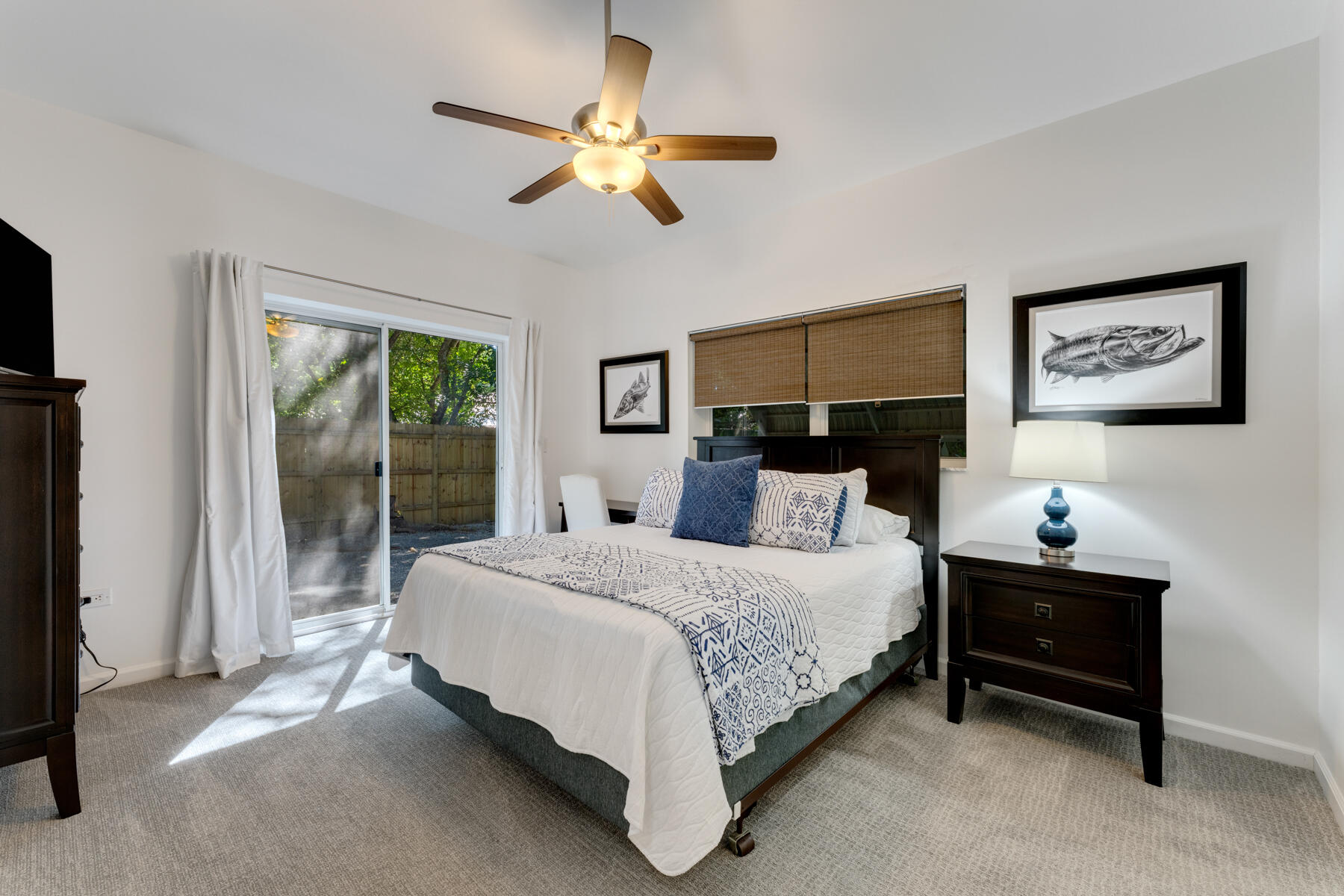 150 Apache Street Tavernier, FL 33070 - Photo 14 of 32 a bedroom with a bed and a chandelier