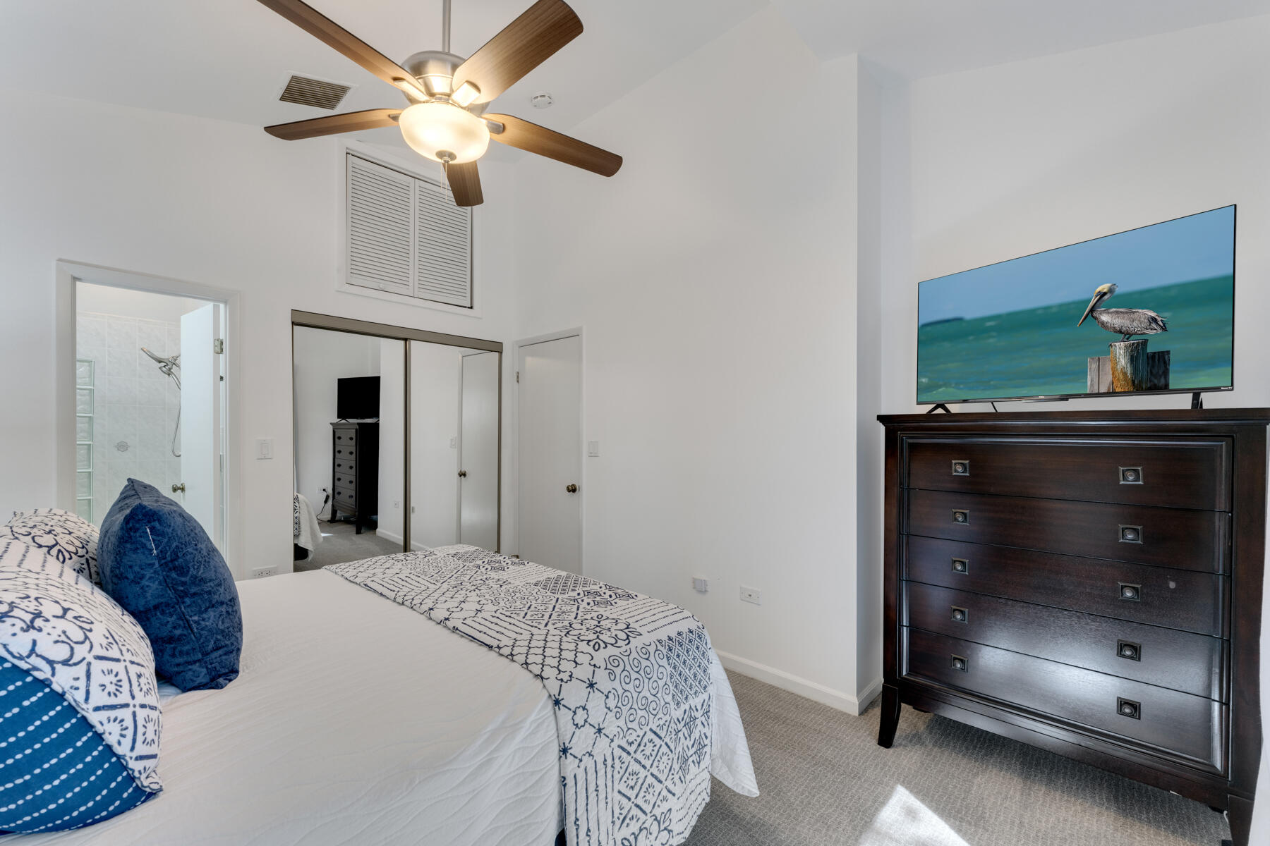 150 Apache Street Tavernier, FL 33070 - Photo 15 of 32 a bedroom with a bed and a fireplace