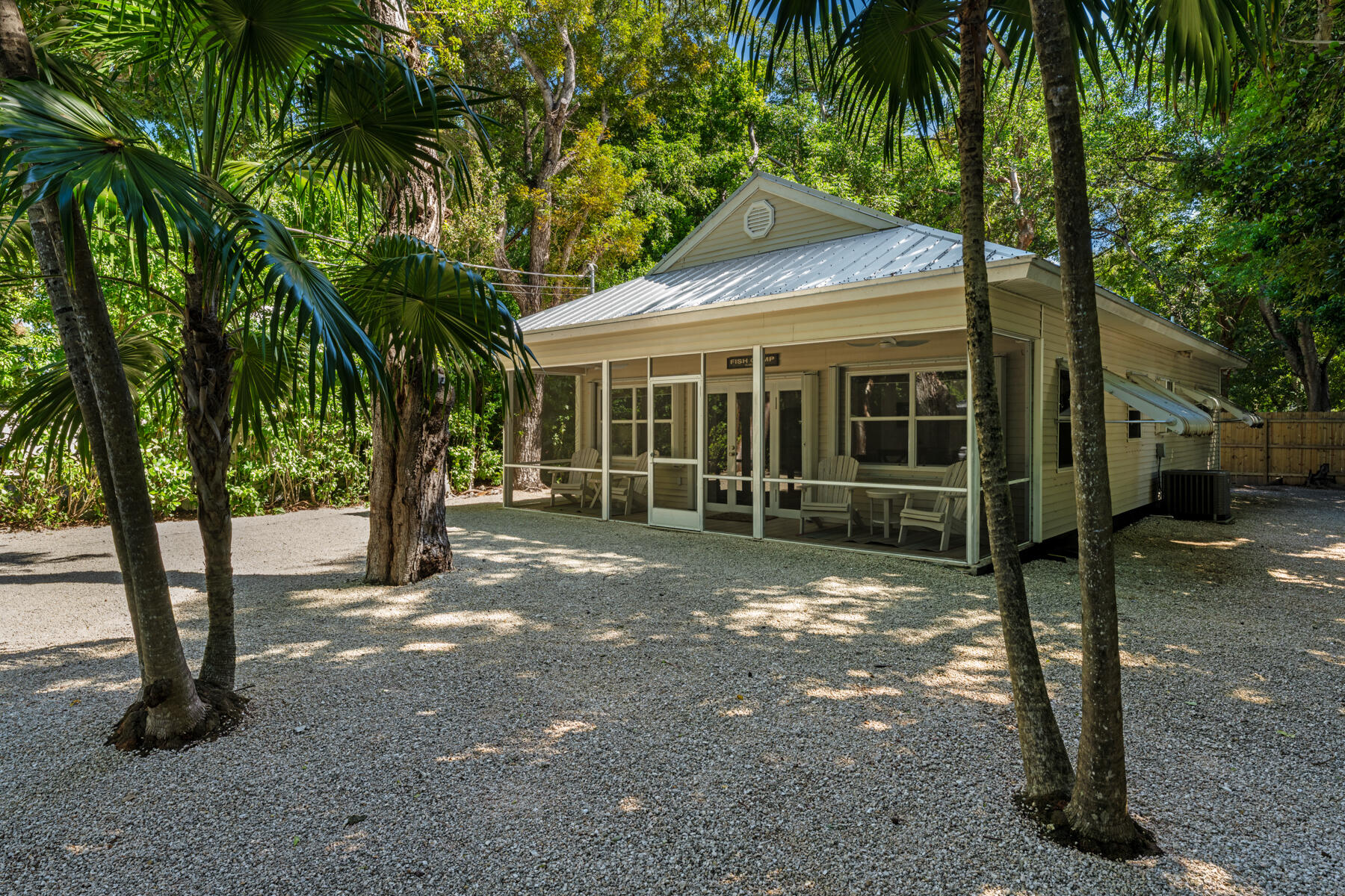 150 Apache Street Tavernier, FL 33070 - Photo 20 of 32 a view of a house with a tree in front of it