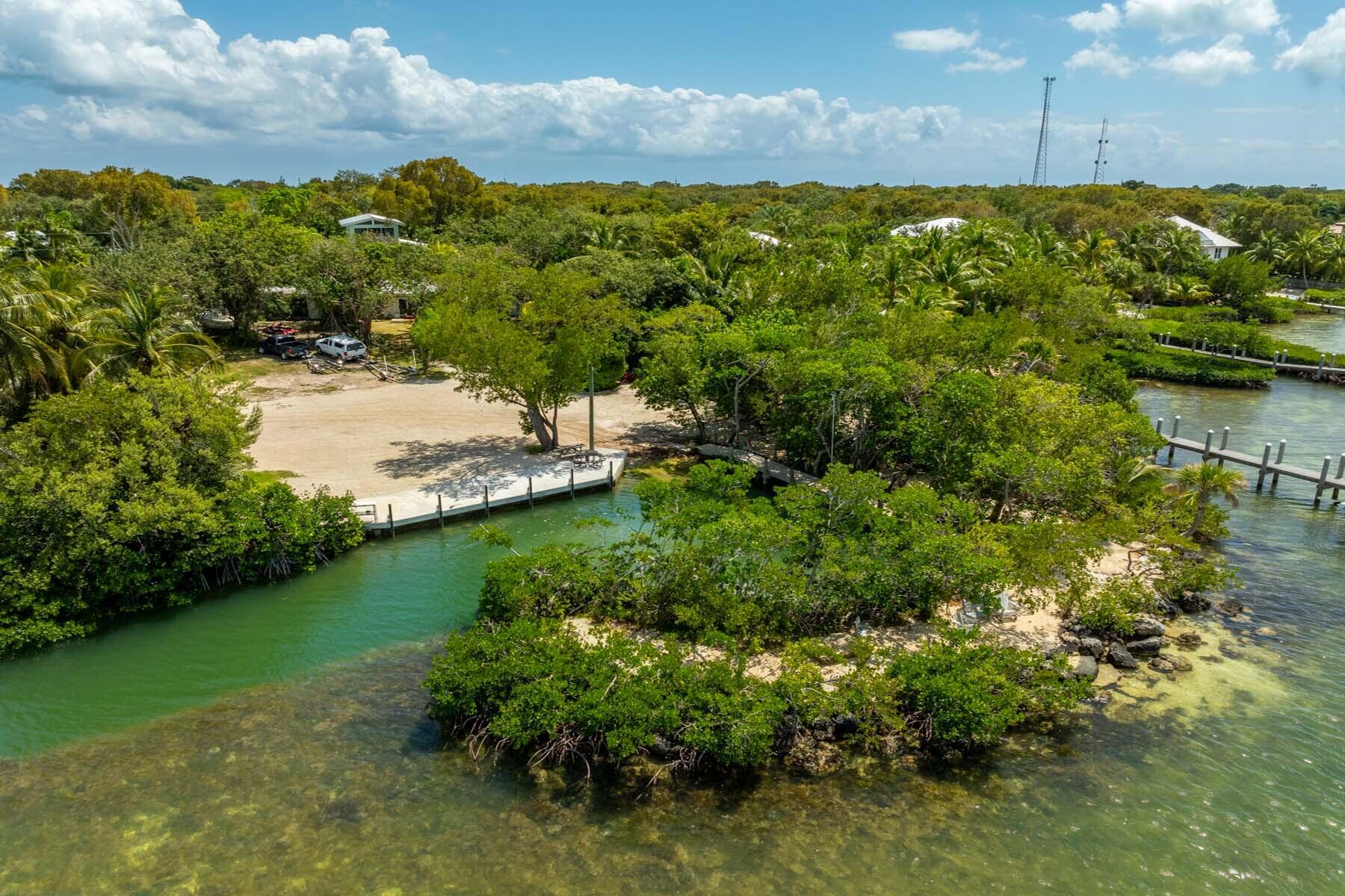 150 Apache Street Tavernier, FL 33070 - Photo 30 of 32 a view of a lake with a yard