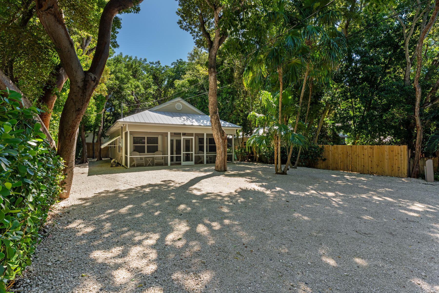 150 Apache Street Tavernier, FL 33070 - Photo 3 of 32 a front view of a house with a yard