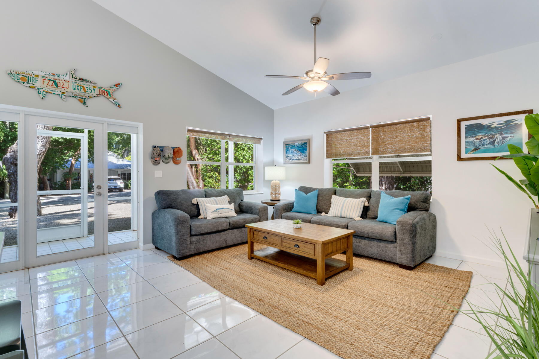 150 Apache Street Tavernier, FL 33070 - Photo 8 of 32 a living room with furniture and a large window