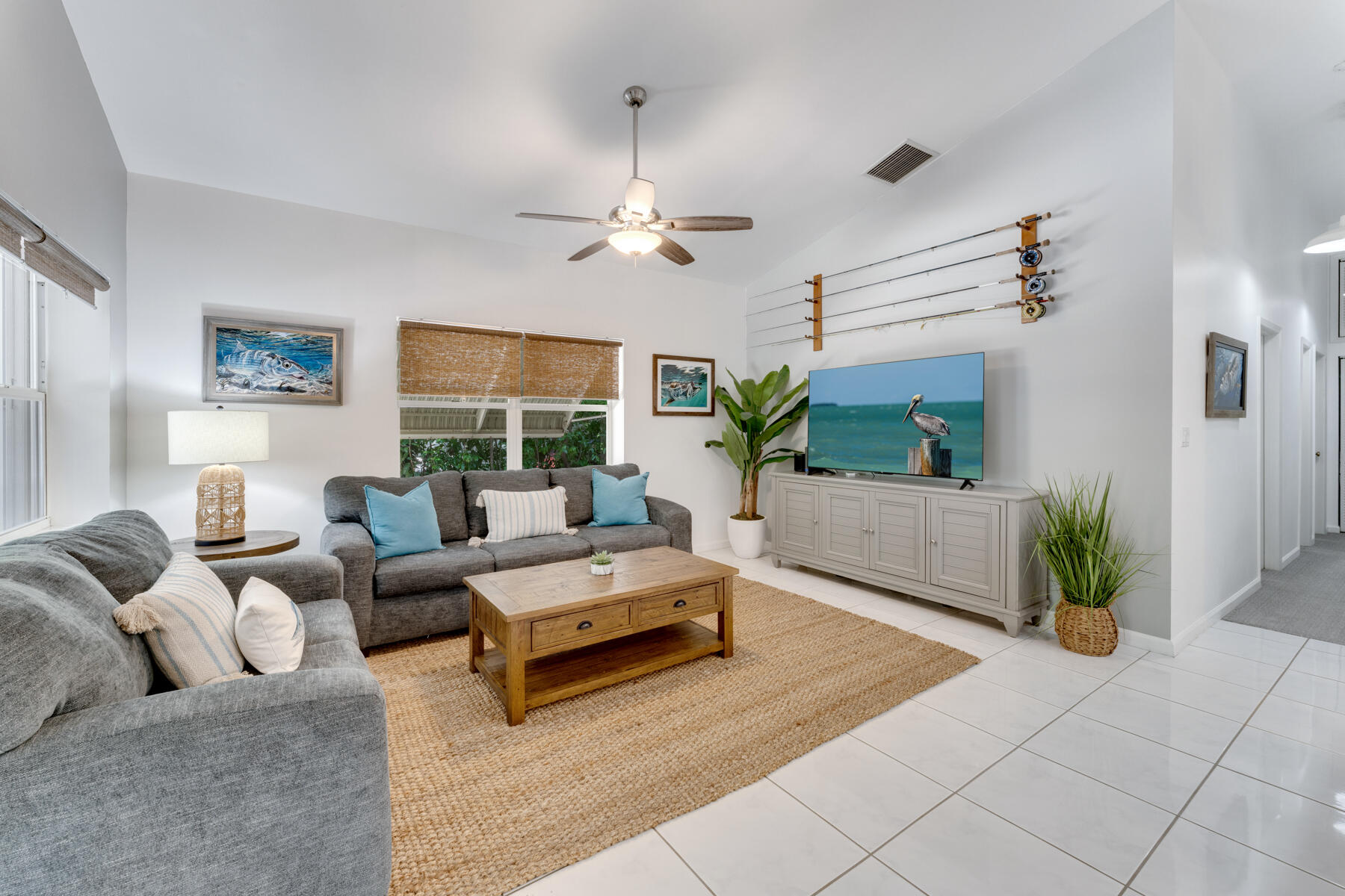 150 Apache Street Tavernier, FL 33070 - Photo 10 of 32 a living room with furniture potted plant and a fireplace