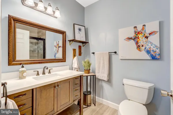 a bathroom with a glass shower door