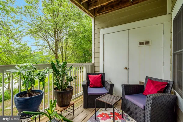 a outdoor living space with furniture and flowers