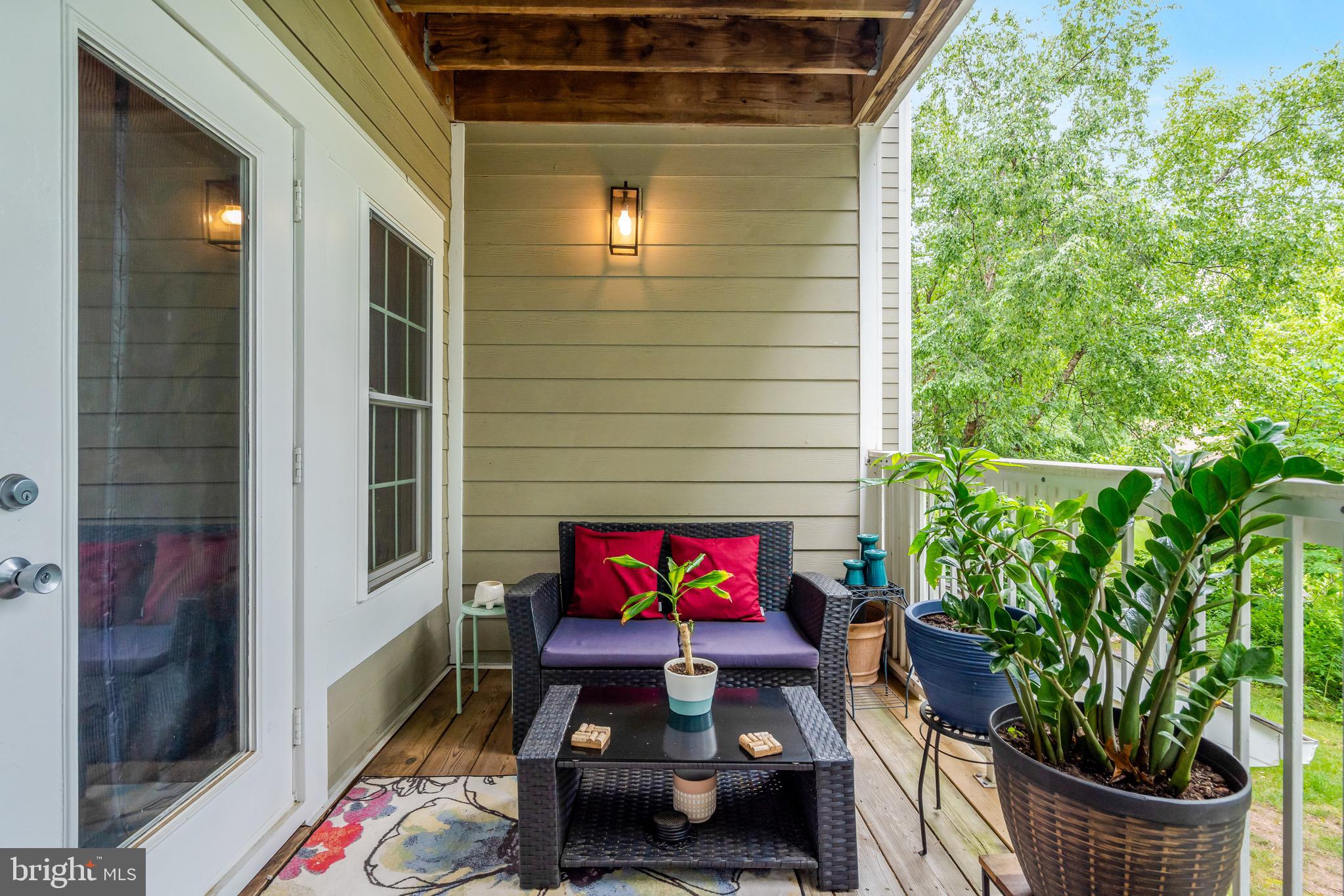 1712 Lake Shore Crest Drive, Unit 14 Reston, VA 20190 - Photo 19 of 24 a outdoor living space with furniture and flowers