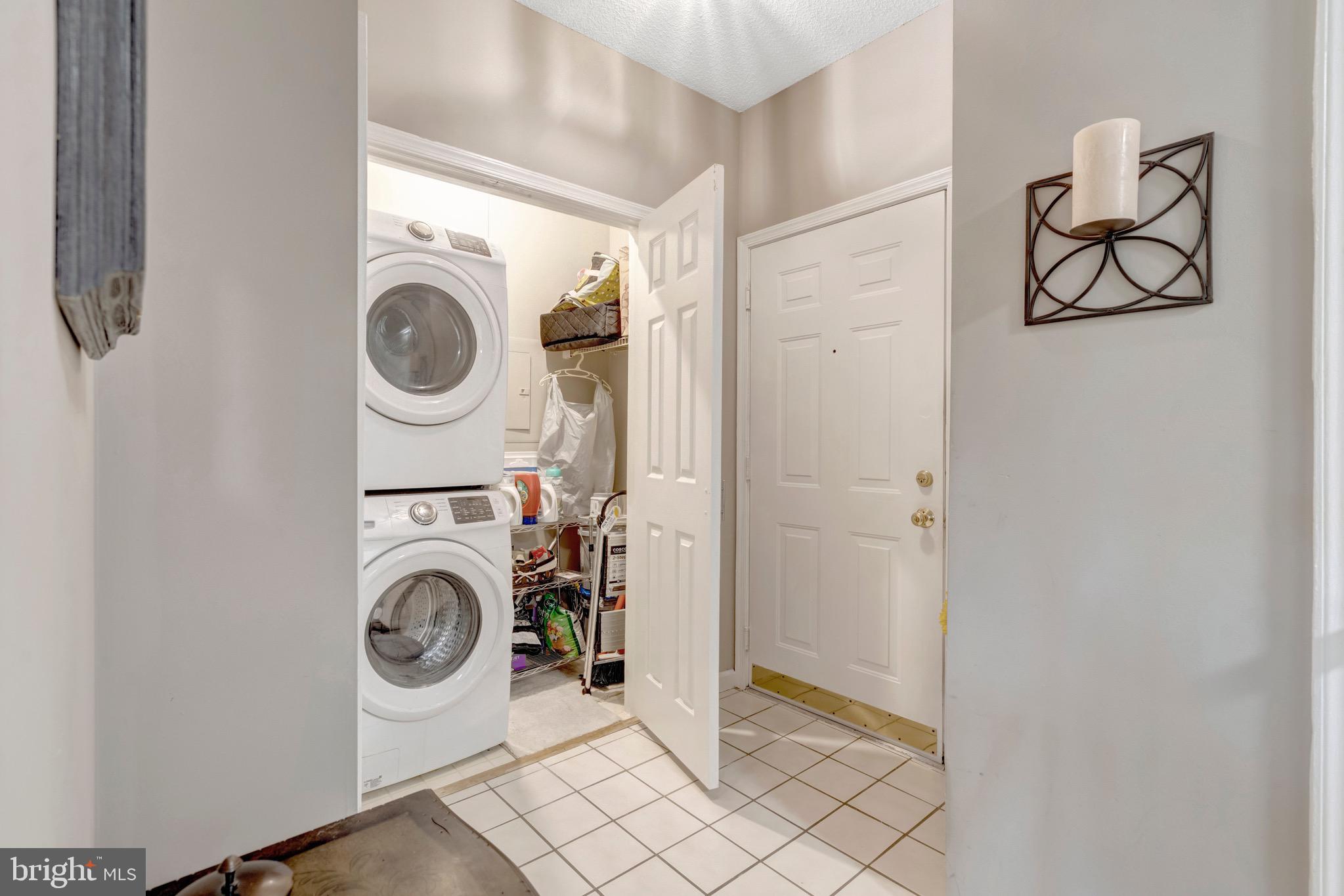 1712 Lake Shore Crest Drive, Unit 14 Reston, VA 20190 - Photo 5 of 24 a utility room with dryer and washer