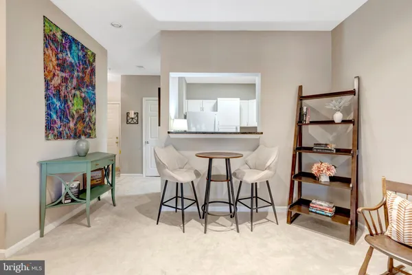a living room with furniture wooden floor and a fireplace