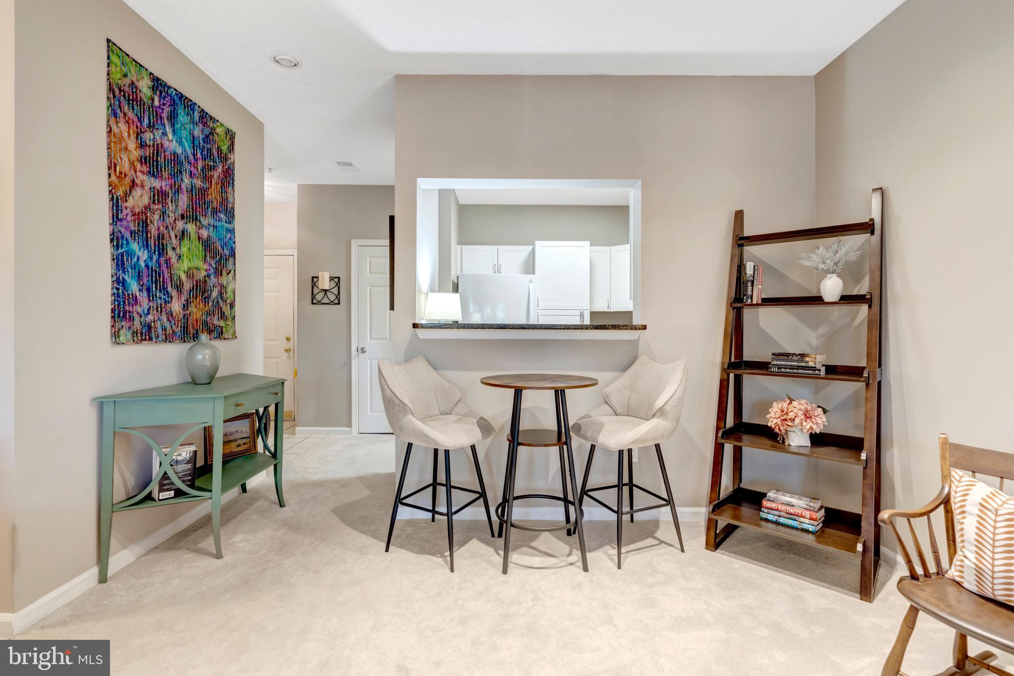 1712 Lake Shore Crest Drive, Unit 14 Reston, VA 20190 - Photo 10 of 24 a view of a livingroom with furniture and furniture