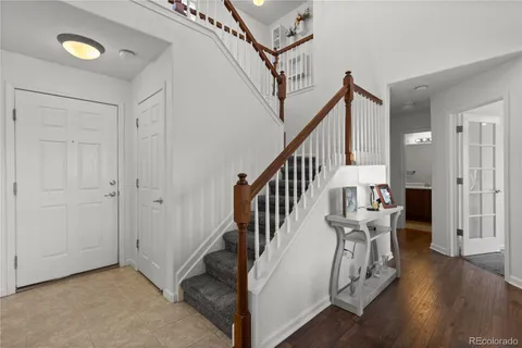 a view of entryway with wooden floor and stairs