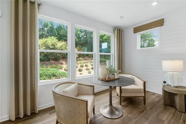 a living room with furniture and a window