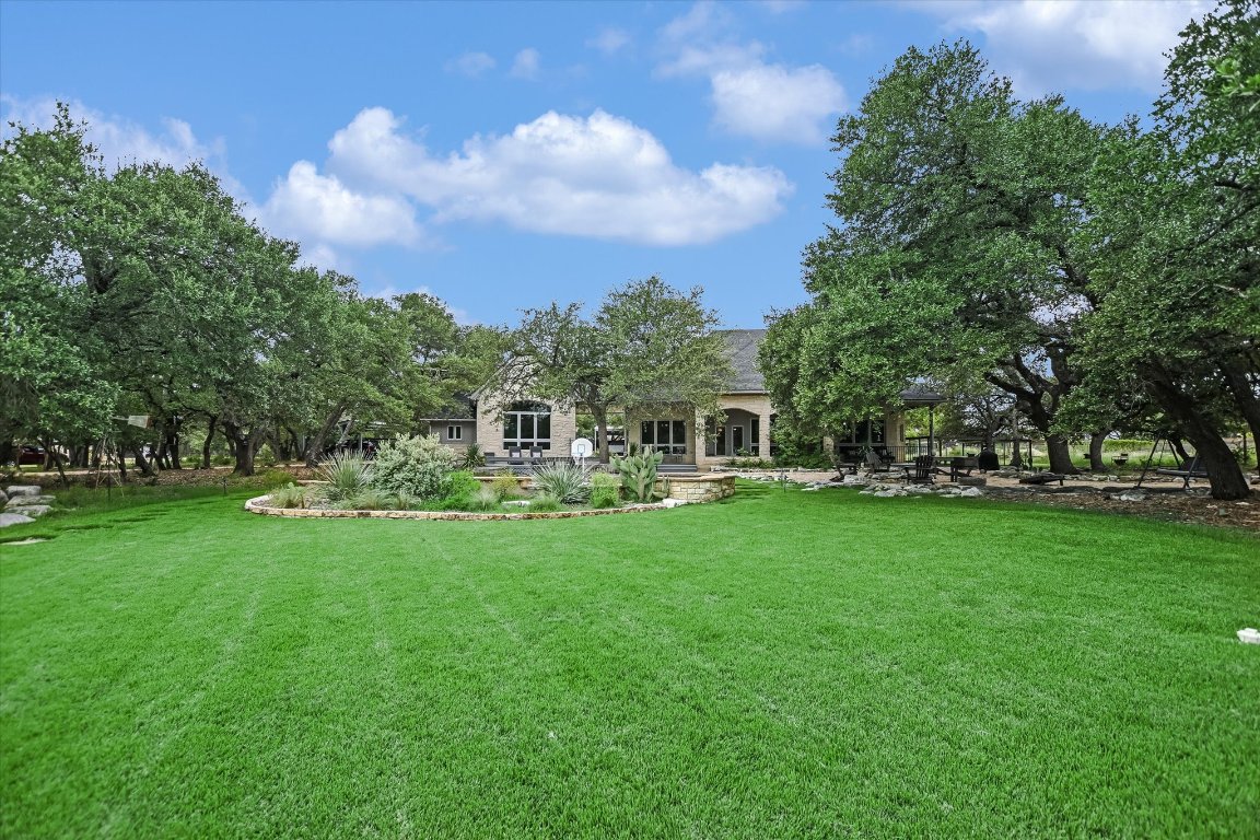 425 Patricia Road Georgetown, TX 78628 - Photo 2 of 30 a front view of a house with garden