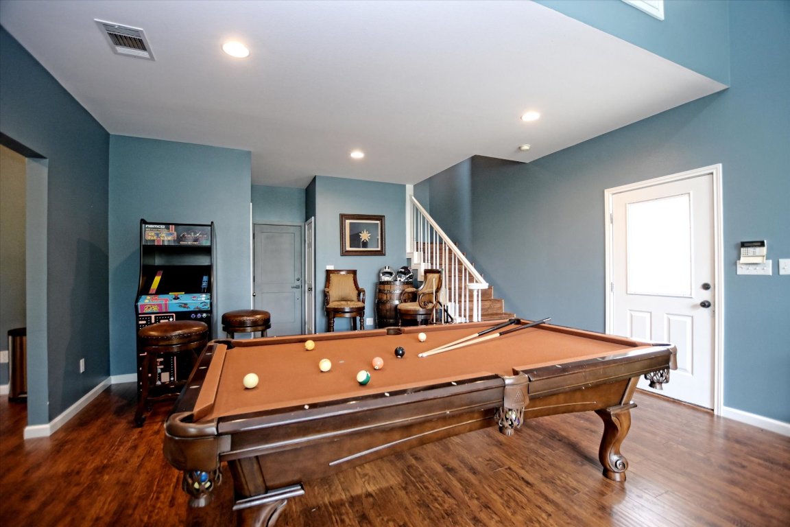 425 Patricia Road Georgetown, TX 78628 - Photo 21 of 30 a room with furniture pool table wooden floor and windows