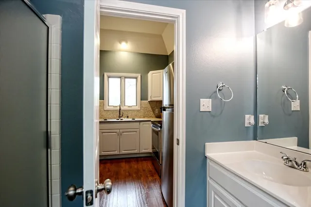 a bathroom with a sink and a mirror