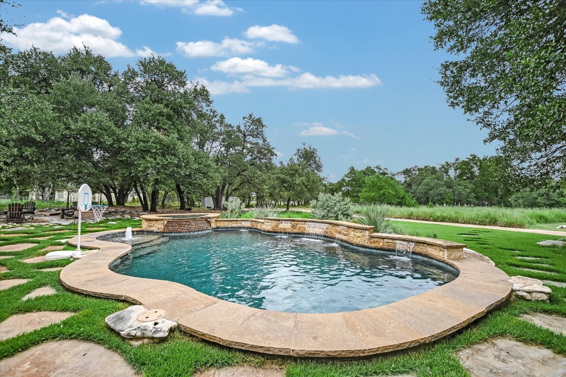 425 Patricia Road Georgetown, TX 78628 - Photo 26 of 30 a view of a swimming pool with a yard