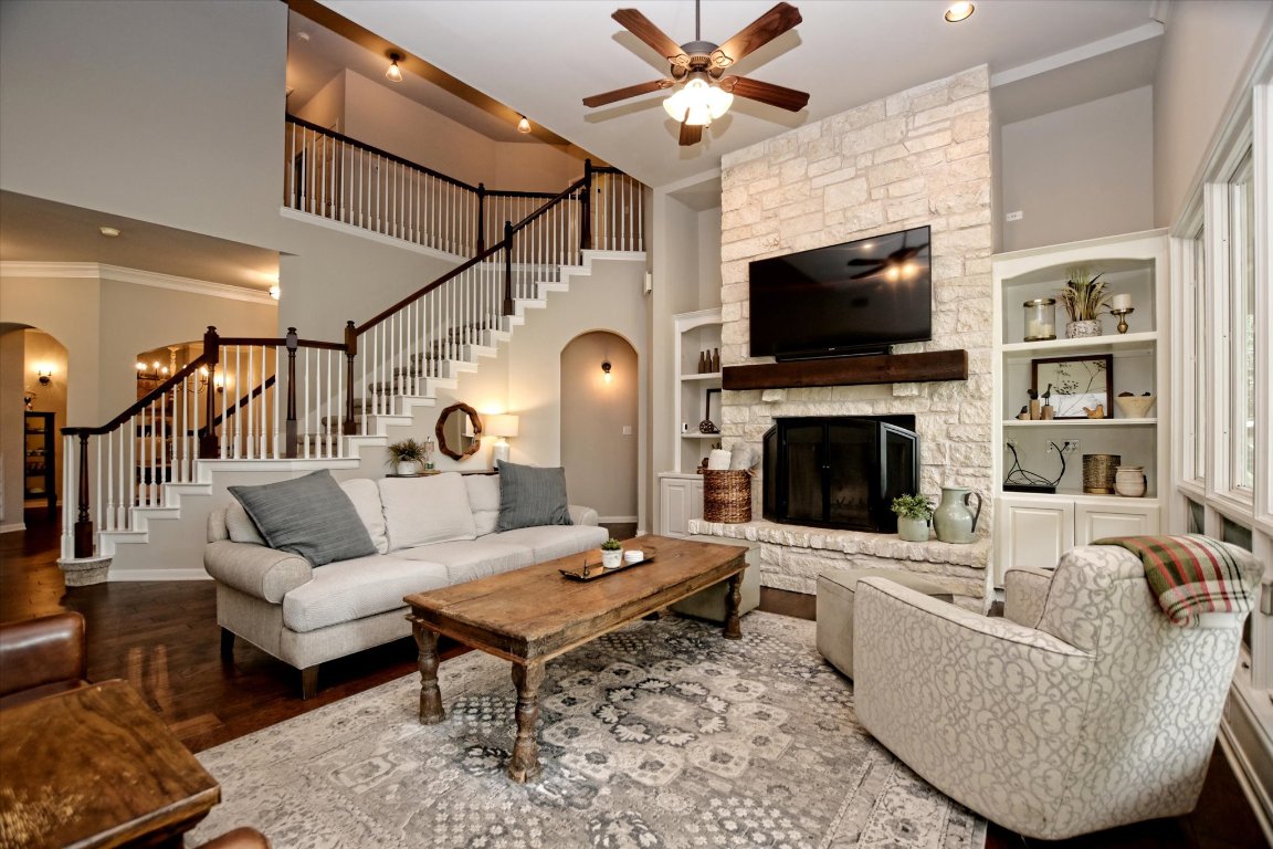 425 Patricia Road Georgetown, TX 78628 - Photo 8 of 30 a living room with furniture a flat screen tv and a fireplace