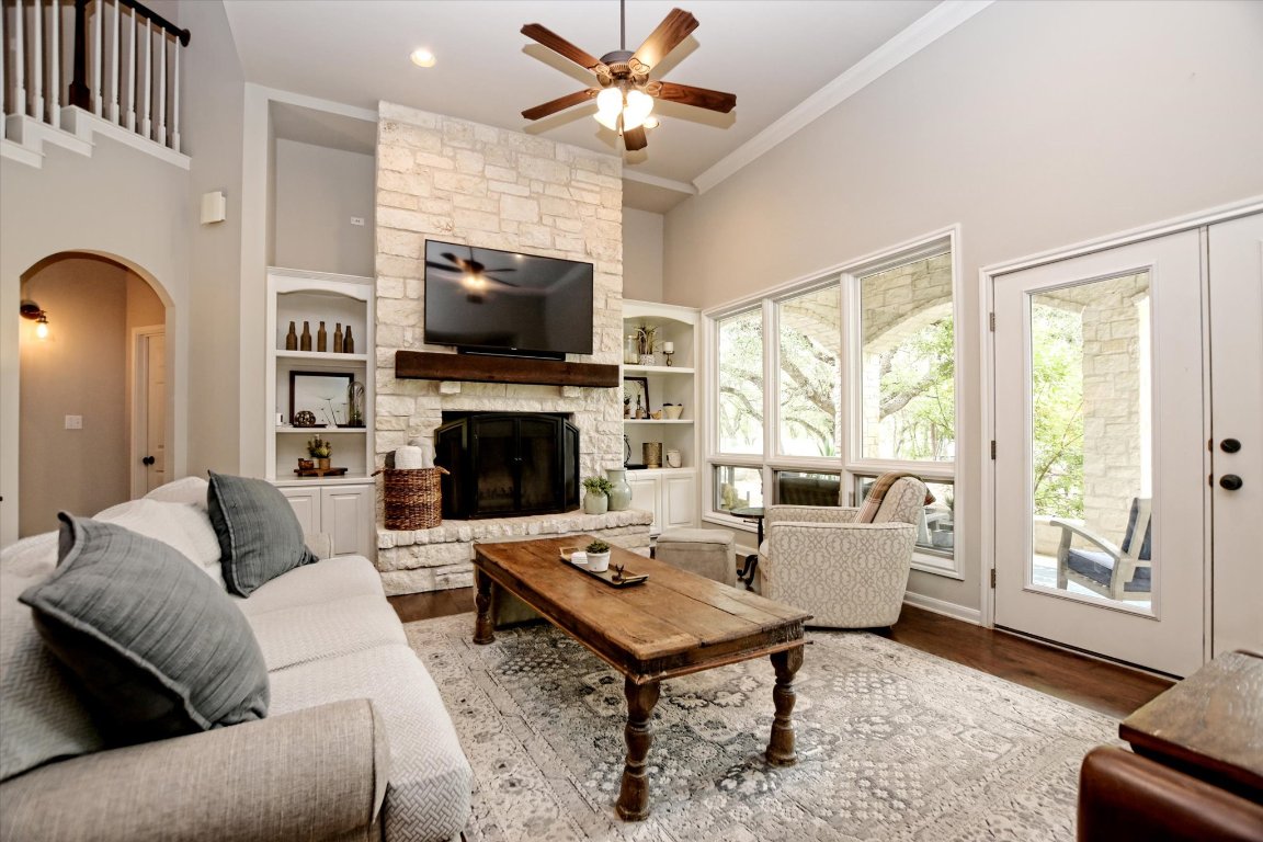 425 Patricia Road Georgetown, TX 78628 - Photo 9 of 30 a living room with furniture a flat screen tv and a fireplace
