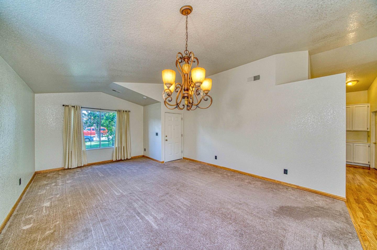 1228 Meadow Lane Tracy, CA 95377 - Photo 16 of 40 a view of entryway with window and chandelier