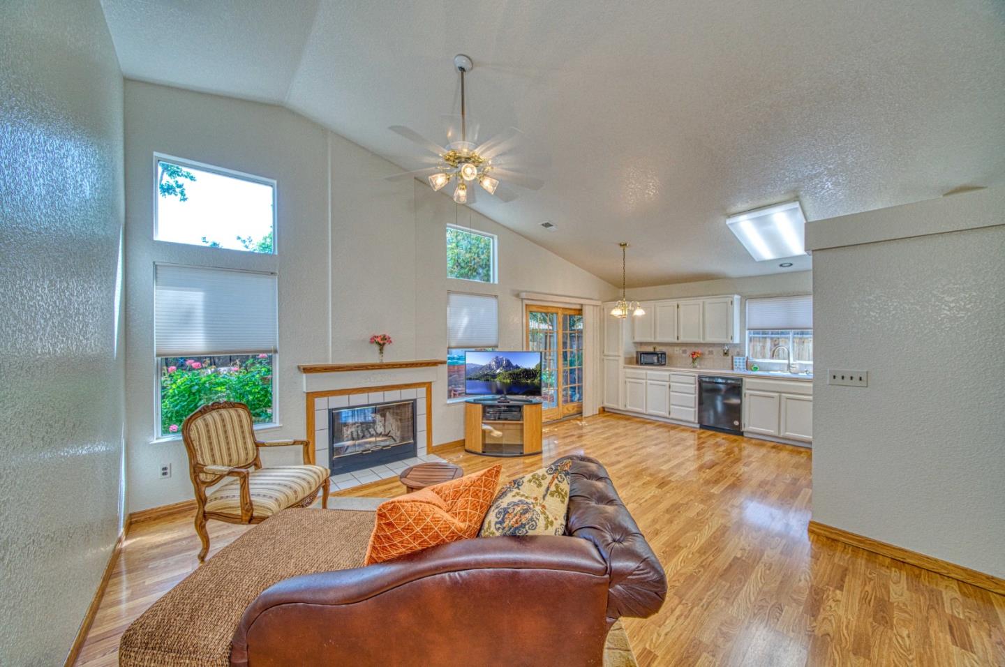 1228 Meadow Lane Tracy, CA 95377 - Photo 18 of 40 a living room with furniture fireplace and kitchen view
