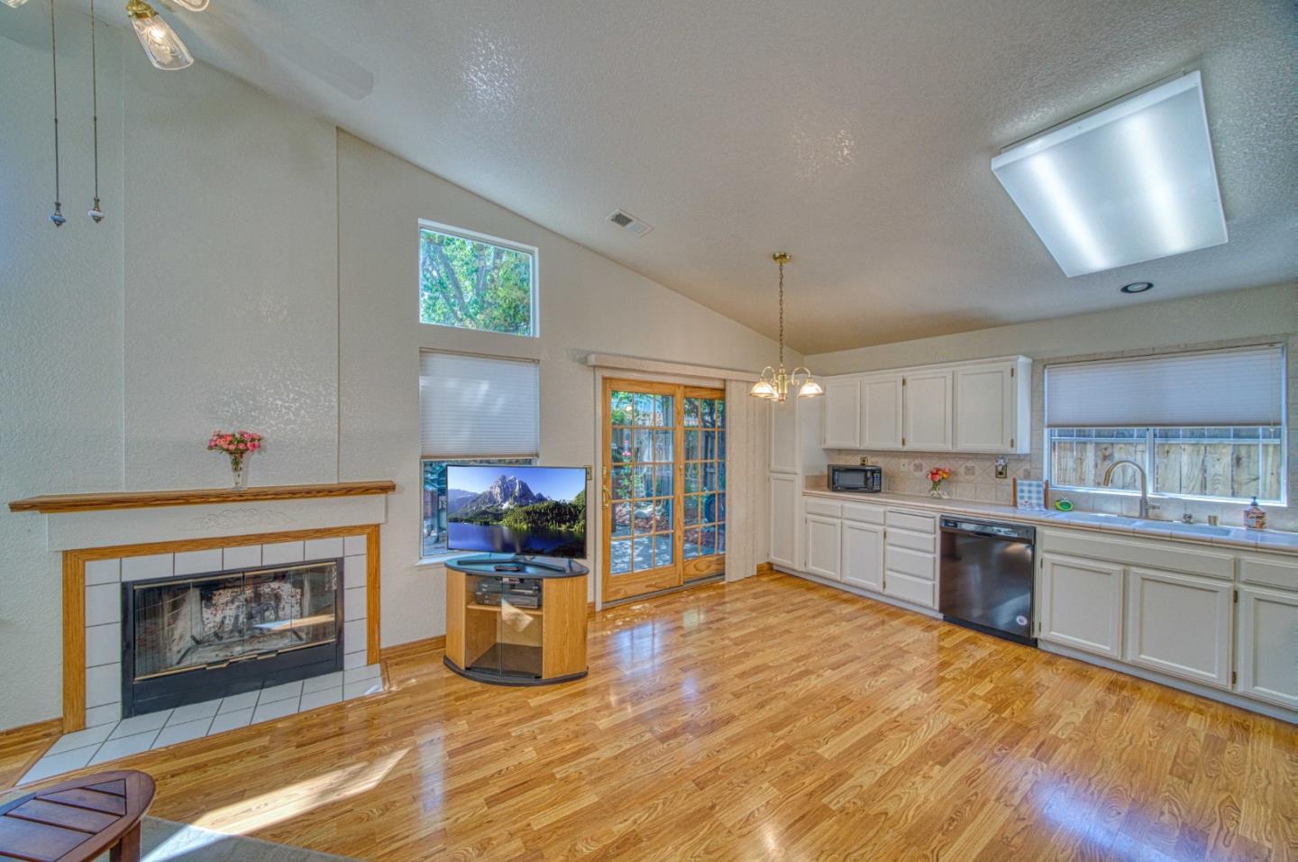 1228 Meadow Lane Tracy, CA 95377 - Photo 20 of 40 a large kitchen with a stove fireplace and a window