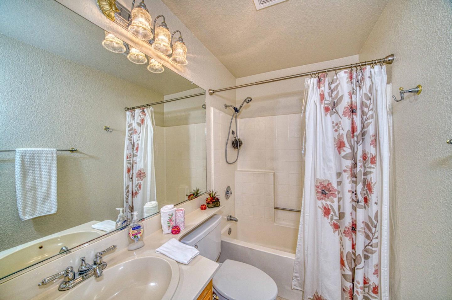 1228 Meadow Lane Tracy, CA 95377 - Photo 32 of 40 a bathroom with a sink toilet and shower