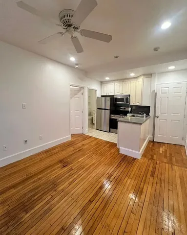 a view of a kitchen with a sink and microwave
