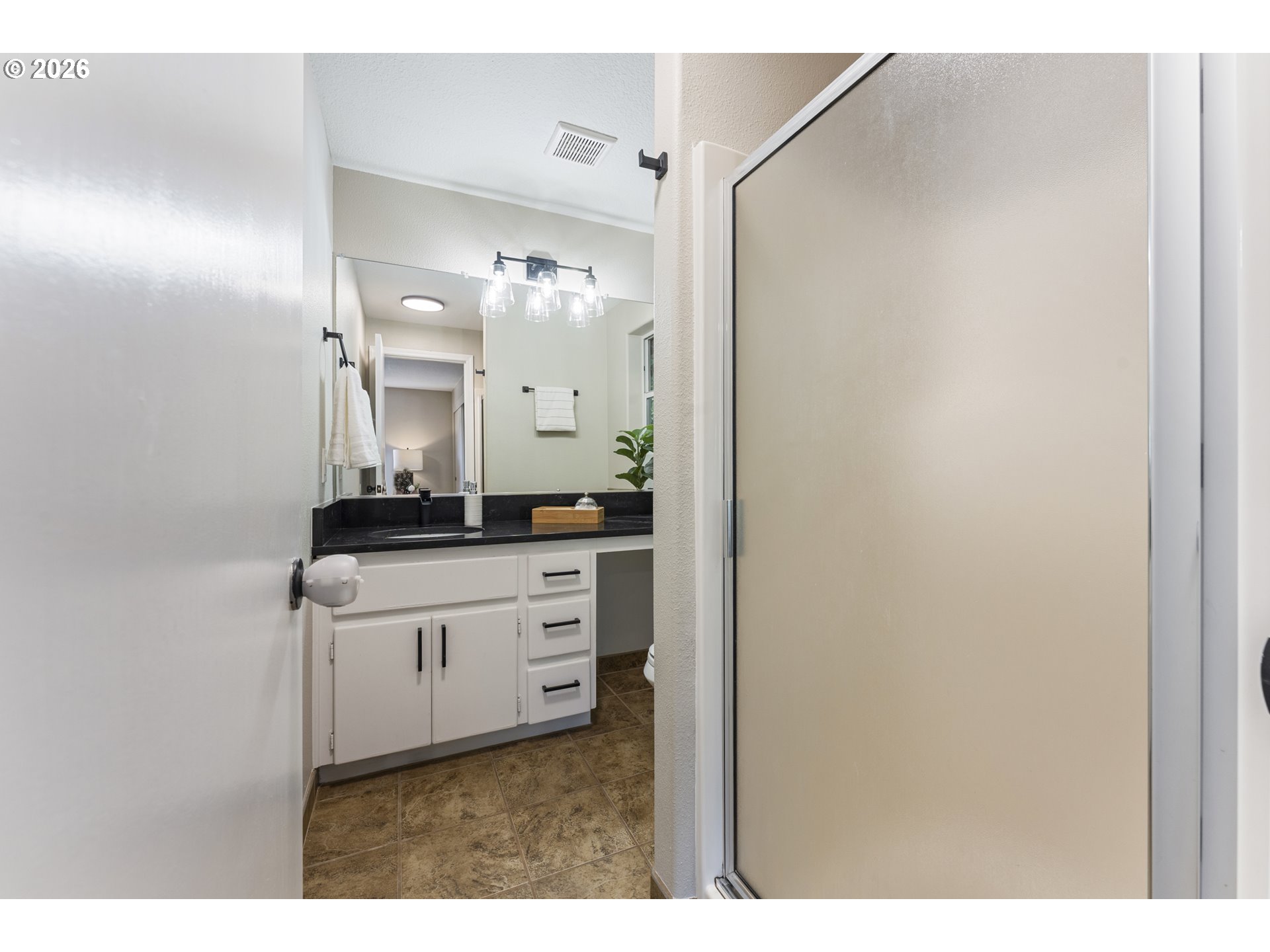4024 Southeast 154th Place Portland, OR 97236 - Photo 13 of 43 a bathroom with a sink and a mirror
