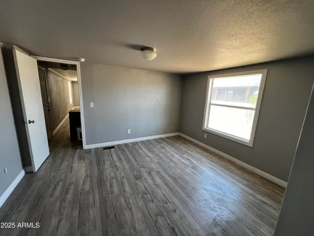 a bathroom with a sink a toilet a mirror and shower