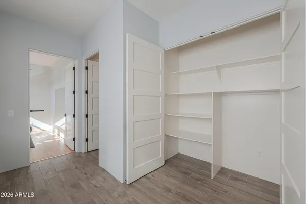 a view of an empty room with a bathroom