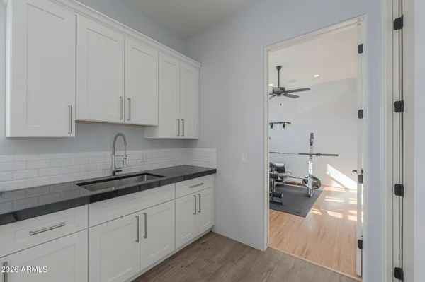 a bathroom with a shower and a glass door