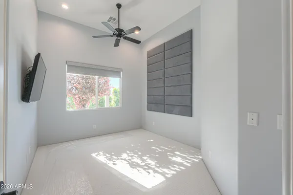 a view of walk in closet with empty racks