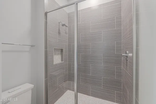 a view of a house with a big yard and potted plants