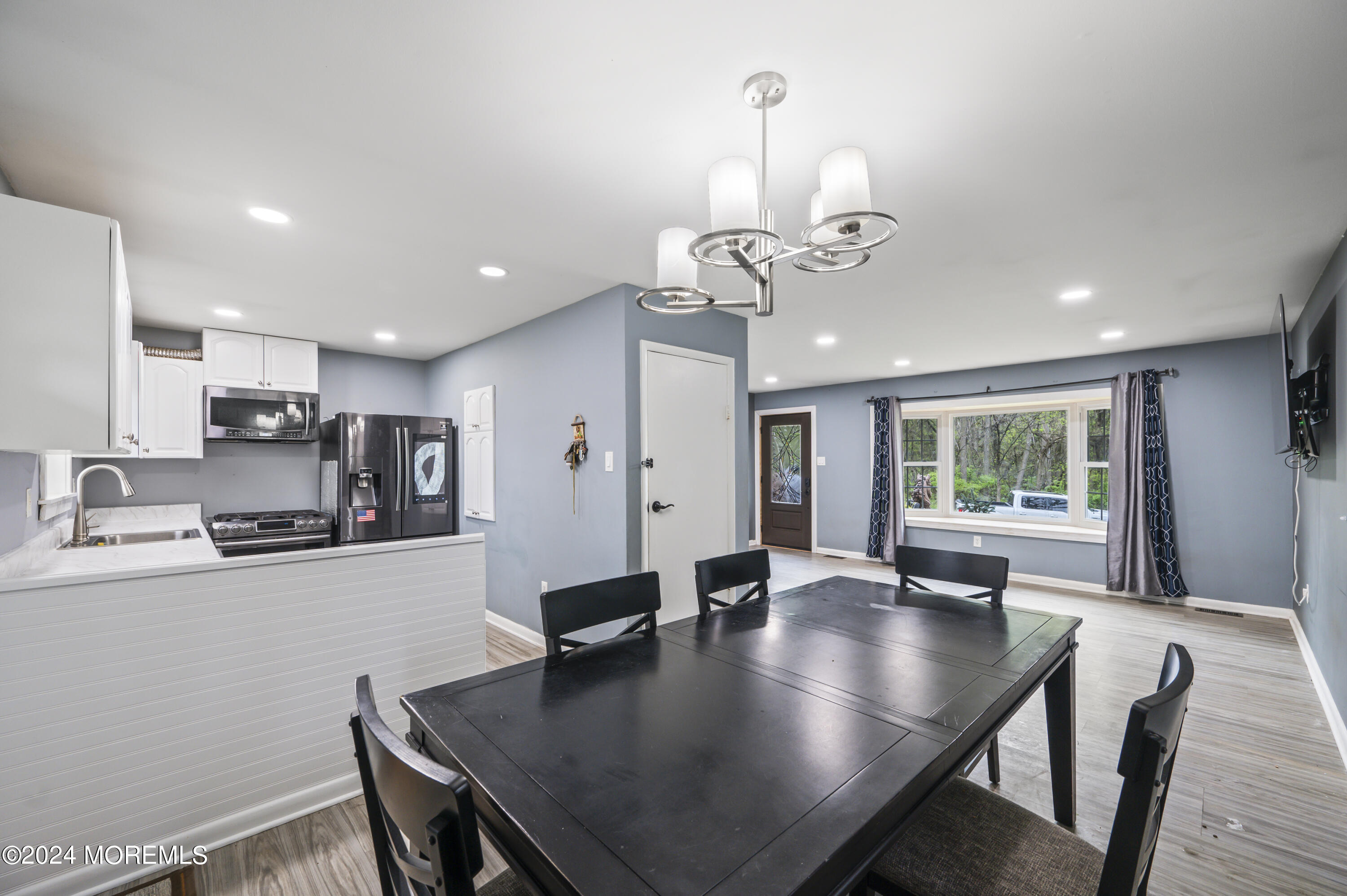 201 Hollowbrook Drive Ewing, NJ 08638 - Photo 11 of 44 a view of a dining room with furniture window and wooden floor