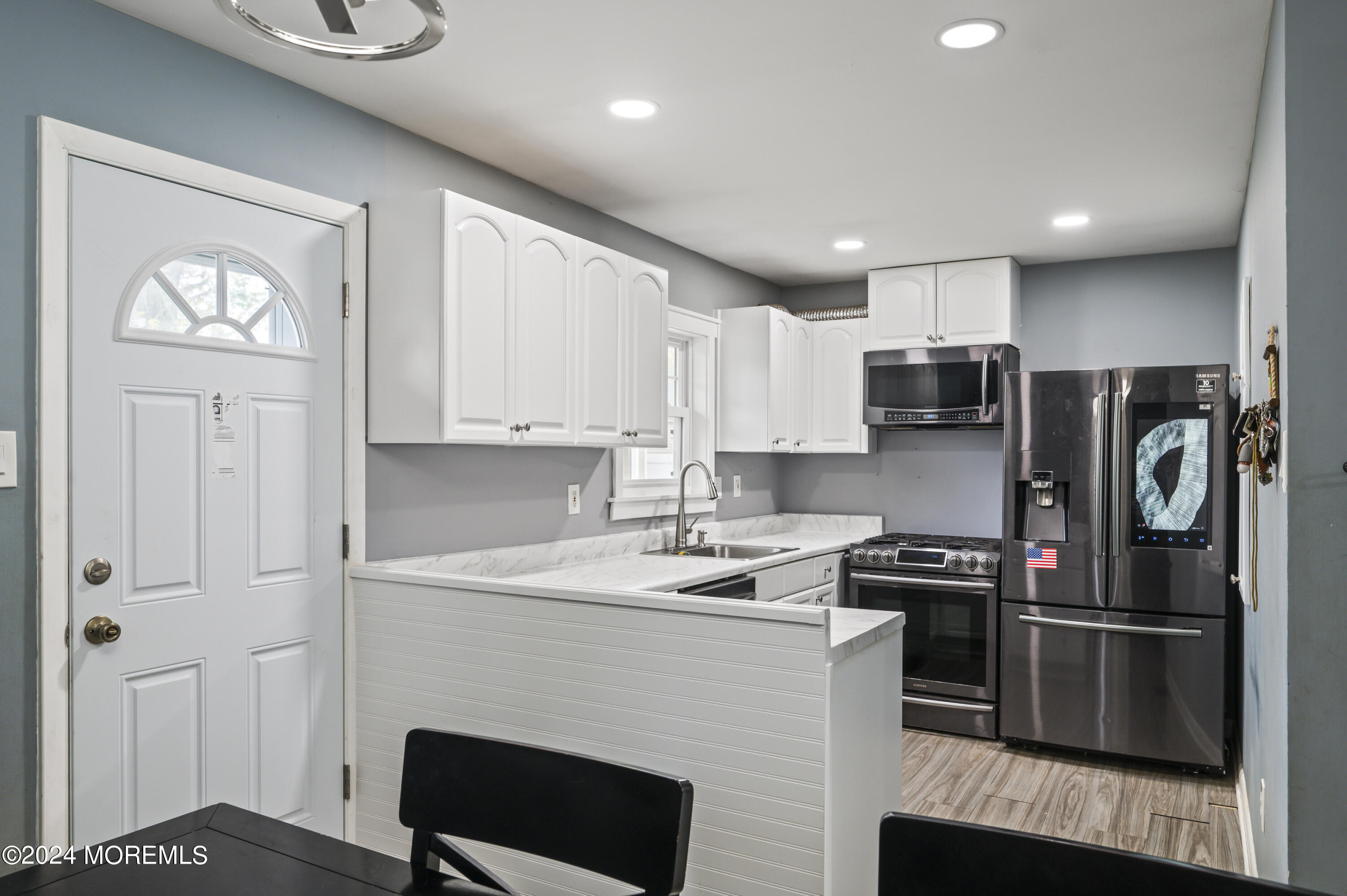 201 Hollowbrook Drive Ewing, NJ 08638 - Photo 12 of 44 a kitchen with stainless steel appliances a refrigerator a stove a sink and a cabinets