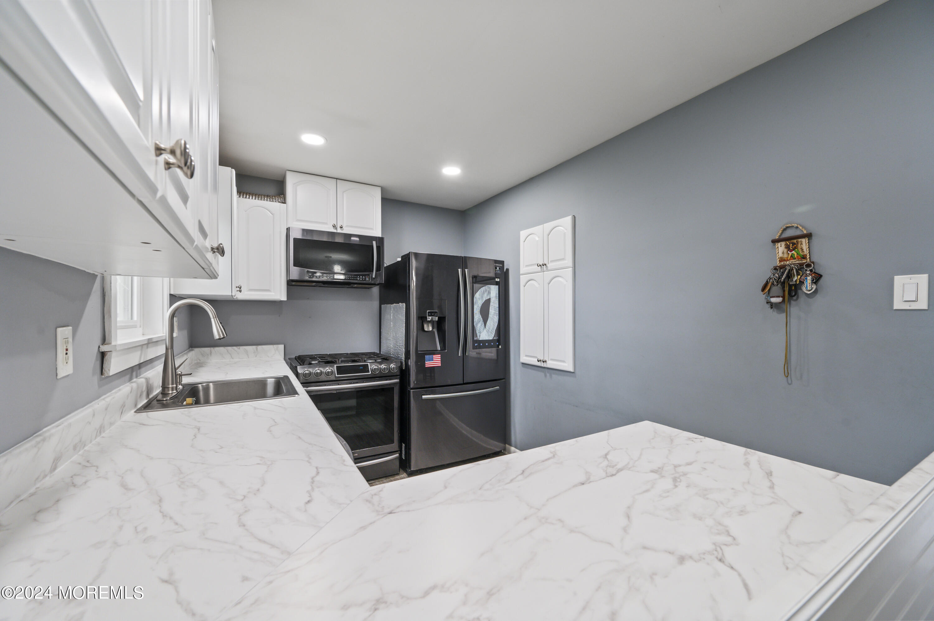 201 Hollowbrook Drive Ewing, NJ 08638 - Photo 14 of 44 a kitchen with stainless steel appliances granite countertop a refrigerator and a sink