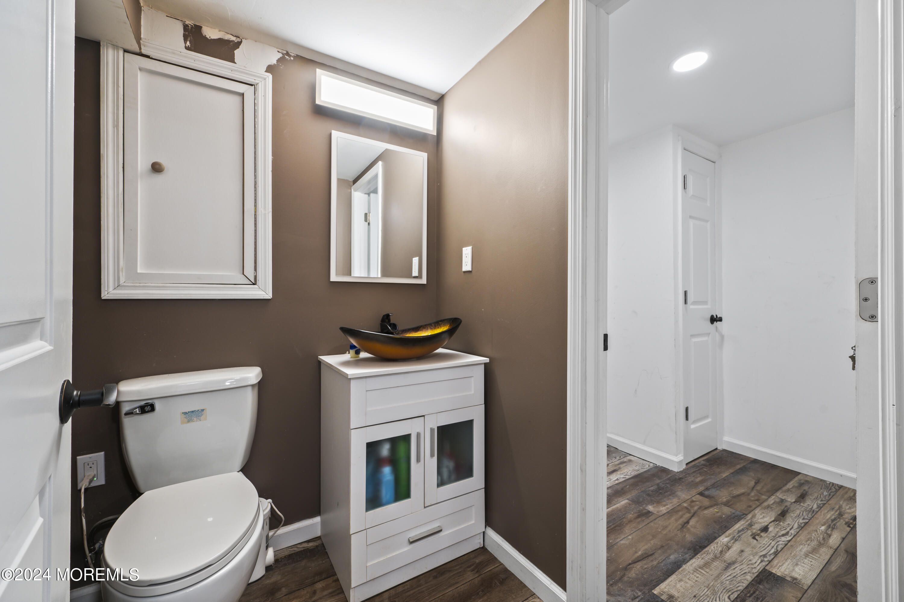 201 Hollowbrook Drive Ewing, NJ 08638 - Photo 32 of 44 a bathroom with a toilet a sink and mirror