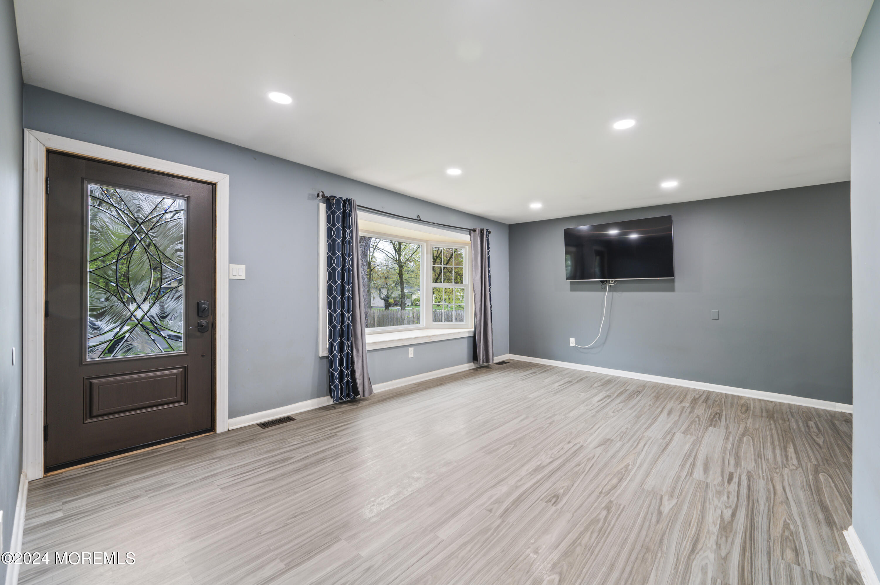 201 Hollowbrook Drive Ewing, NJ 08638 - Photo 7 of 44 a view of an empty room with wooden floor and a window
