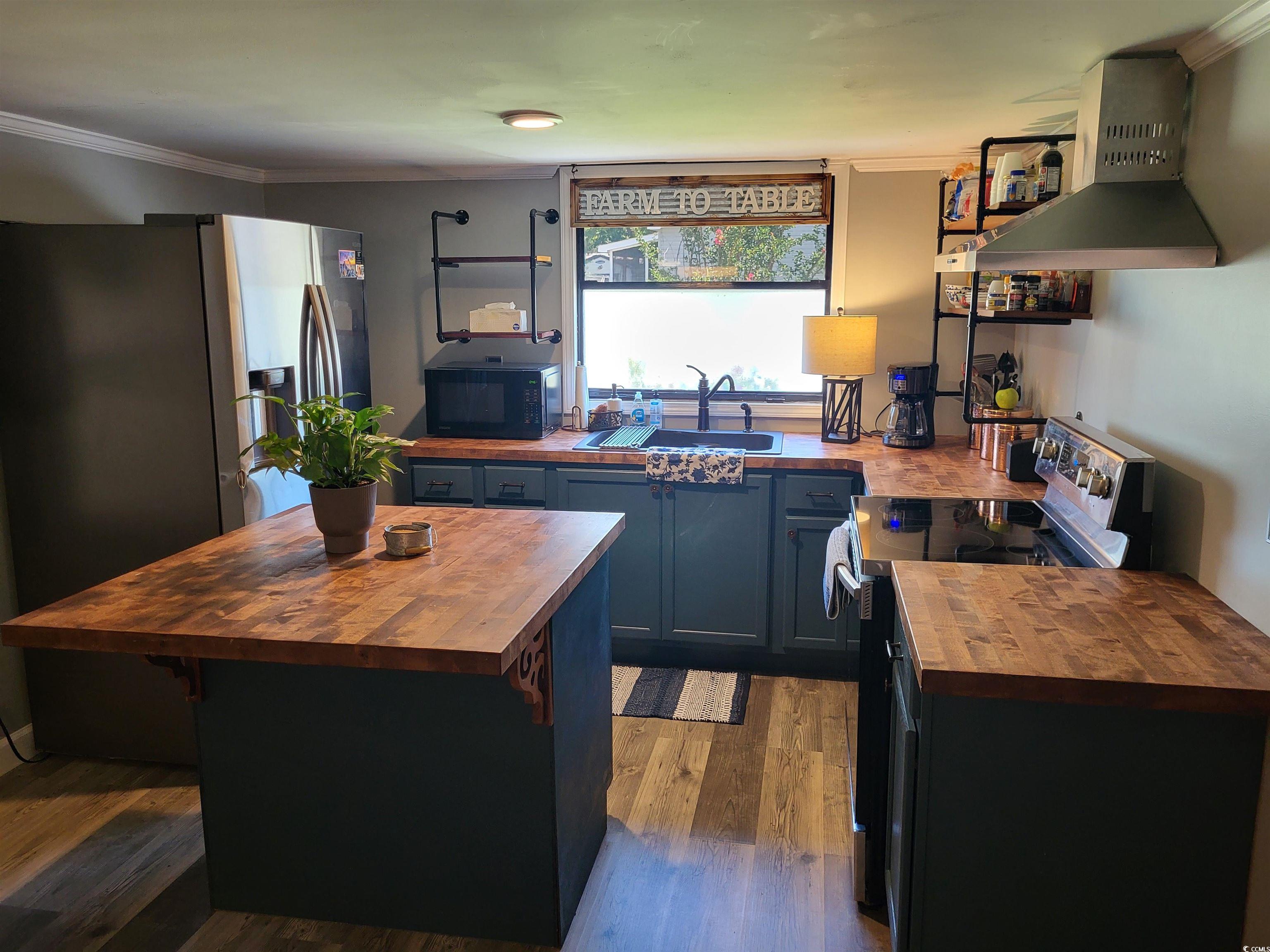 180 Offshore Drive Murrells Inlet, SC 29576 - Photo 2 of 23 Kitchen with wood counters, electric stove, sink,
