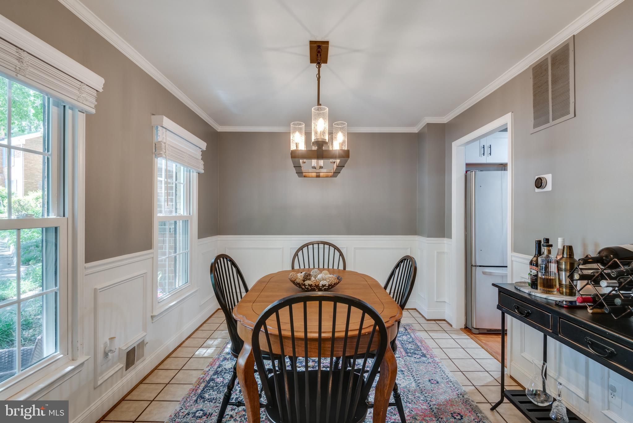 2406 Albot Road Reston, VA 20191 - Photo 5 of 29 Dining room with crown molding and wainscoting