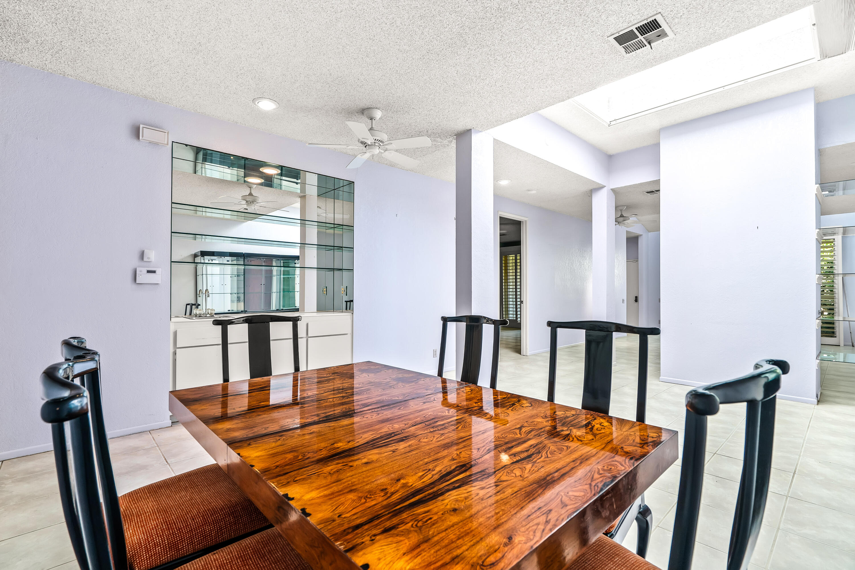 1384 East Andreas Road Palm Springs, CA 92262 - Photo 17 of 46 a dining room with furniture and wooden floor
