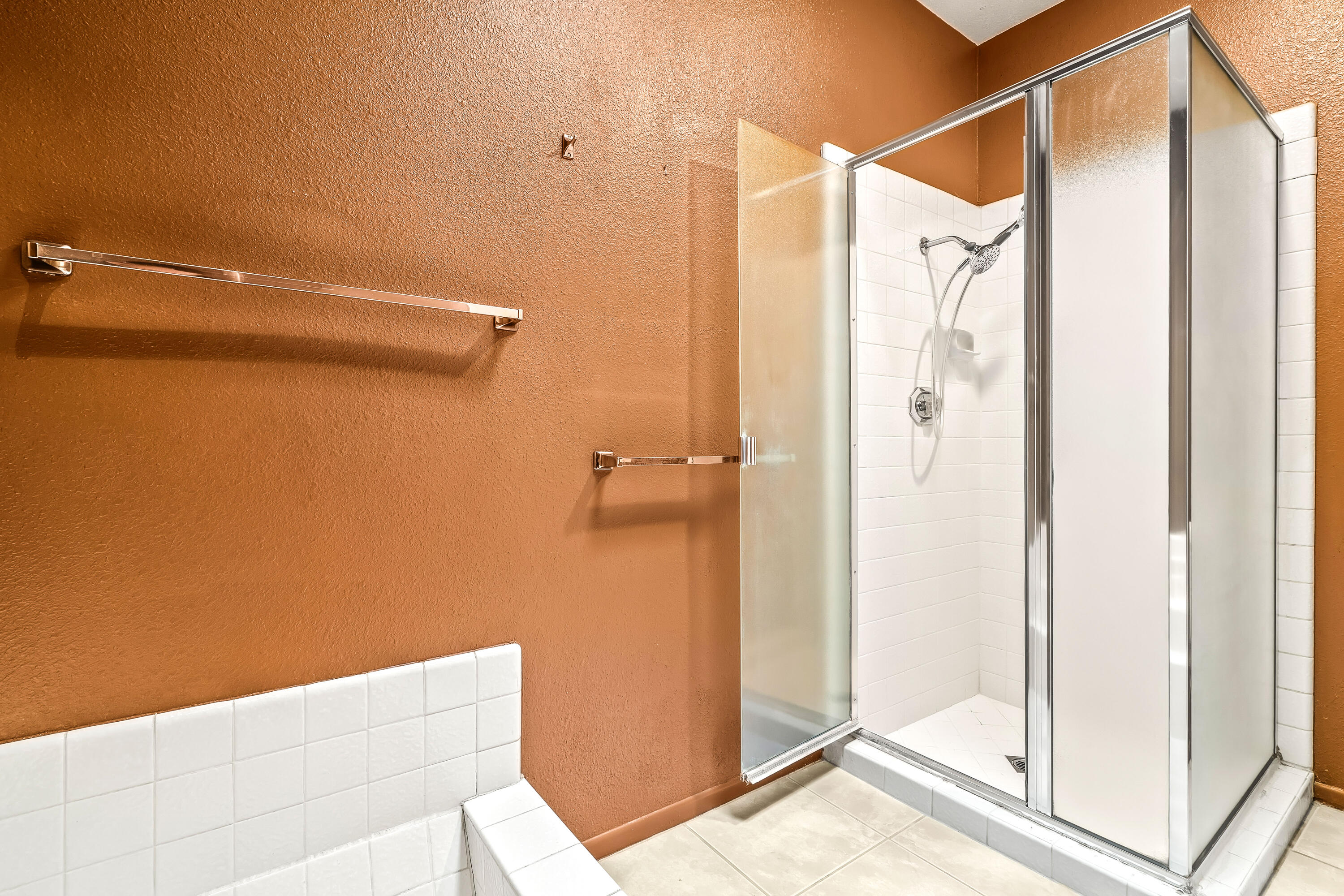 1384 East Andreas Road Palm Springs, CA 92262 - Photo 31 of 46 a bathroom with a shower and a glass door