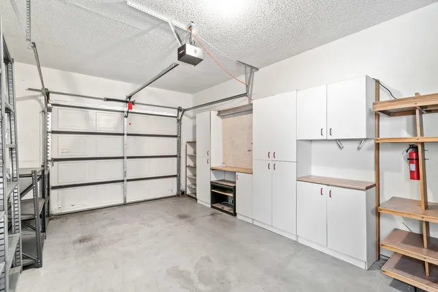 a view of a room with cabinet and air conditioner duct