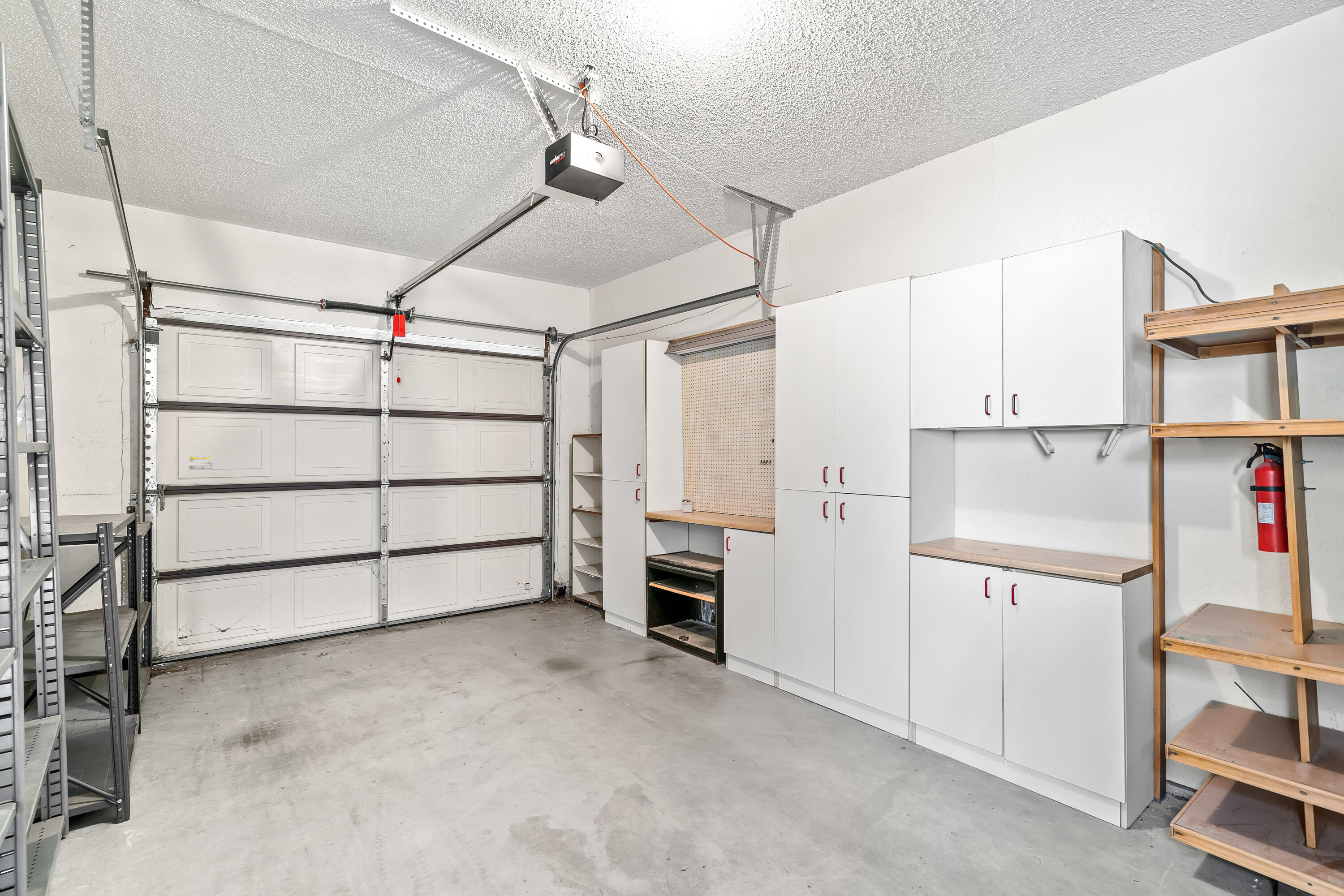 1384 East Andreas Road Palm Springs, CA 92262 - Photo 35 of 46 a view of a room with cabinet and air conditioner duct